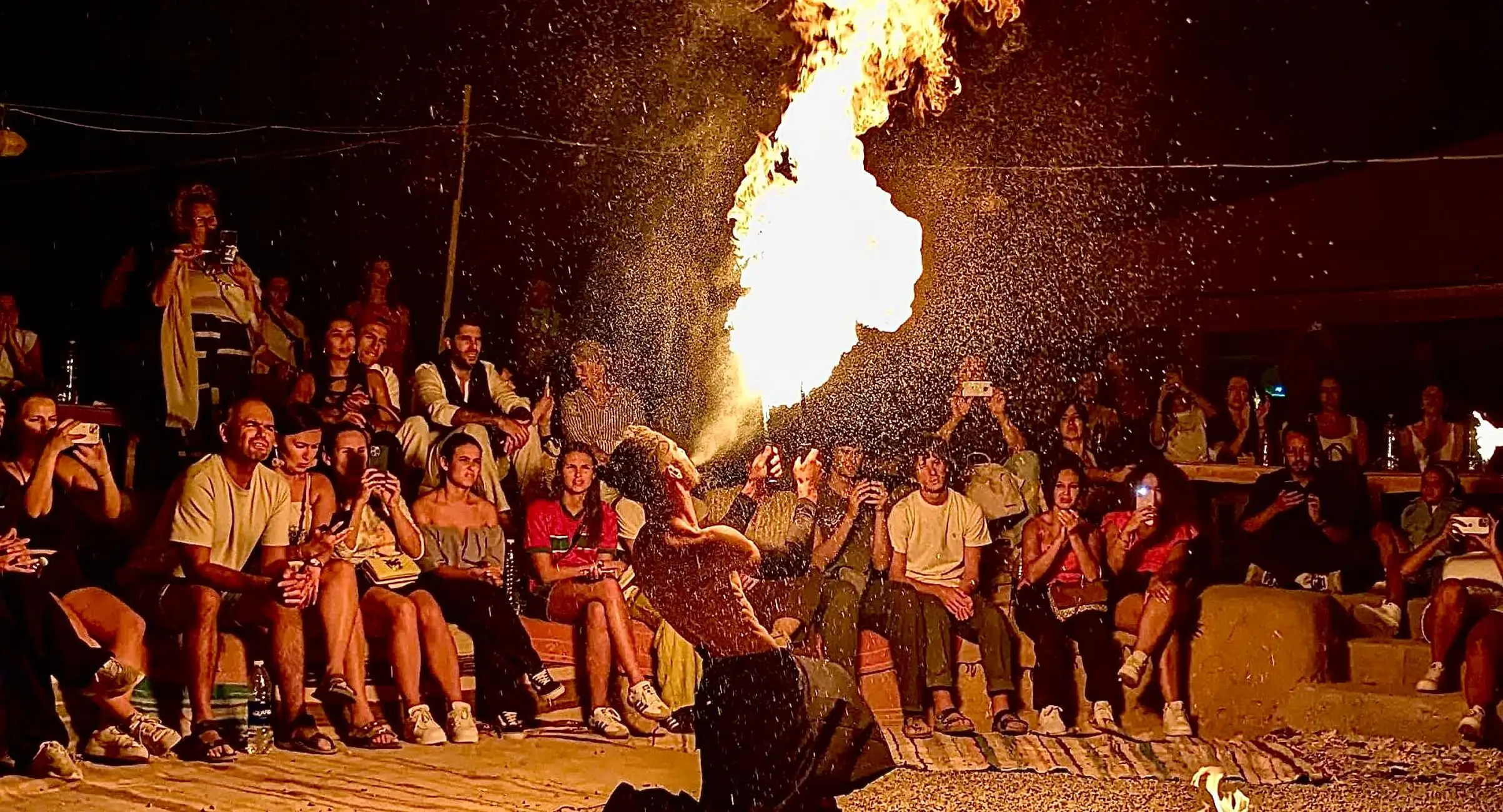 Agafay Desert rocky landscape with camel trekking under blue sky